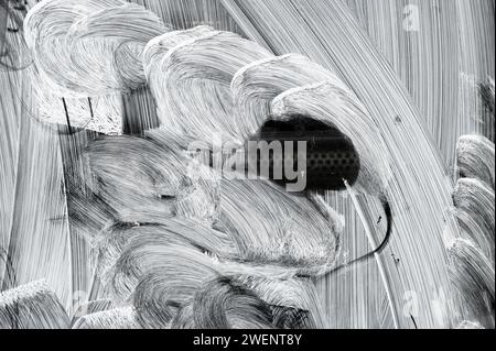 A peep hole in a blanked out window Stock Photo