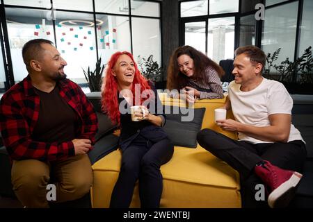 Friendly group of employee having fun during coffee break Stock Photo