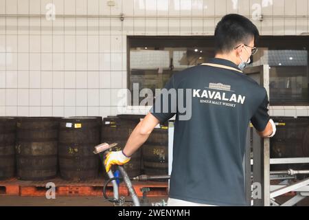 Yuanshan, Republic of China - October 2, 2023: A factory worker at the Kavalan Whisky Distillery, a popular tourist attraction in Yilan County, Taiwan Stock Photo