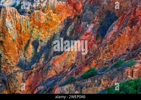 Dramatic abstract landscape of Algarve coastline in Lagos, Portugal. Otherworldly looking rugged scenery with Mesozoic sedimentary rocks and limestone Stock Photo