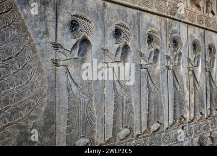 Bas-relief on the Grand Staircase of Apadana Palace depicts members of the Ten Thousand Immortals, special army of ancient Persia. Persepolis, Iran. Stock Photo