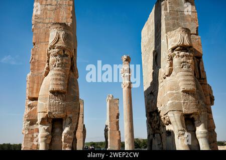 Human-headed winged bulls (Lamassu, protective deity) on the Gate of All Nations in Persepolis, capital of the Achaemenid Empire (550–330 BC), Iran. Stock Photo