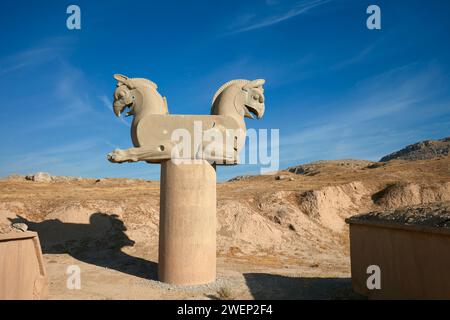 Column capital with two griffin heads in Persepolis, ancient capital of the Persian kings of the Achaemenian dynasty. Fars Province, Iran. Stock Photo