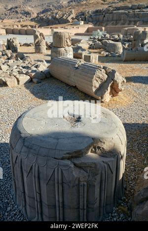 Pieces of fallen ancient columns in Persepolis, ceremonial capital of the Achaemenid Empire (550–330 BC), Iran. Stock Photo