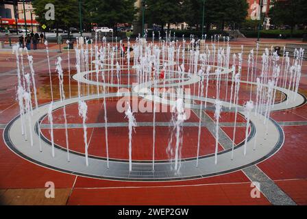 Waters gush from a fountain shaped like the Olympic Rings at Centennial Park, in Atlanta, home of the 1996 Summer Games Stock Photo