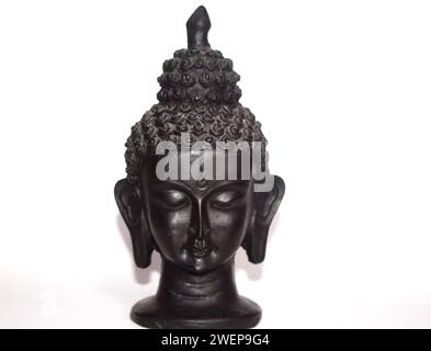 Small black sculpture on white background Stock Photo