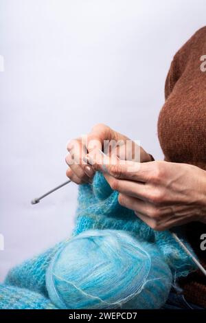 Close-up of hands knitting. Process of knitting. Hand made. Stock Photo