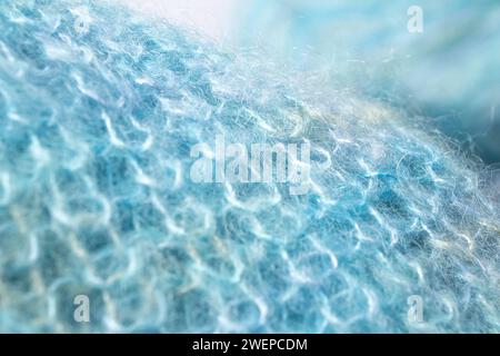 Handmade knitted blanket, trendy concept. Close-up of knitted blanket, merino wool background Stock Photo