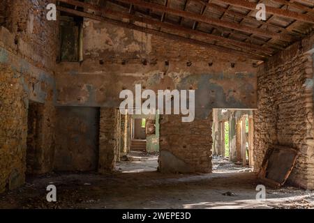 Picture of an abandoned house, half burnt, in the the suburbs of belgrade, serbia, surrounded by a park. Stock Photo
