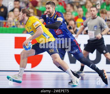 Sweden's Albin Lagergren and France's Nikola Karabatic during the semifinal between Sweden and France at the EHF 2024 Mens European Handball Championship in the Lanxness Arena in Cologne, Germany, Friday January 26, 2024 Credit: Ritzau/Alamy Live News Stock Photo