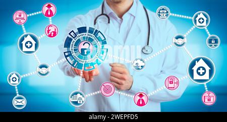 Young male doctor sharing data is exposed to network vulnerabilities created by mergers and acquisitions of medical practices. IT concept for computer Stock Photo