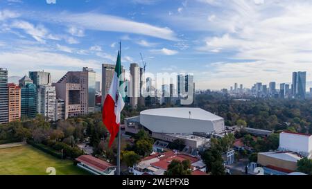 Ciudad De Mexico, Yucatan, USA. 14th Jan, 2024. In Mexico City, the immense Mexican national flag waves proudly against the cityscape and mountainous backdrop, stirred by the gentle breeze (Credit Image: © Walter G Arce Sr Grindstone Medi/ASP) EDITORIAL USAGE ONLY! Not for Commercial USAGE! Stock Photo