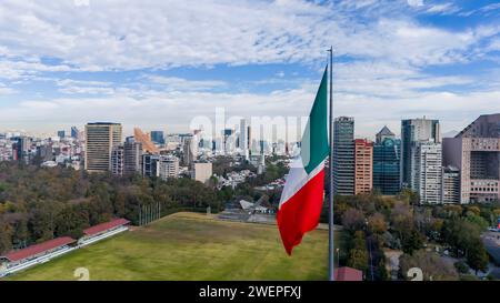 Ciudad De Mexico, Yucatan, USA. 14th Jan, 2024. In Mexico City, the immense Mexican national flag waves proudly against the cityscape and mountainous backdrop, stirred by the gentle breeze (Credit Image: © Walter G Arce Sr Grindstone Medi/ASP) EDITORIAL USAGE ONLY! Not for Commercial USAGE! Stock Photo