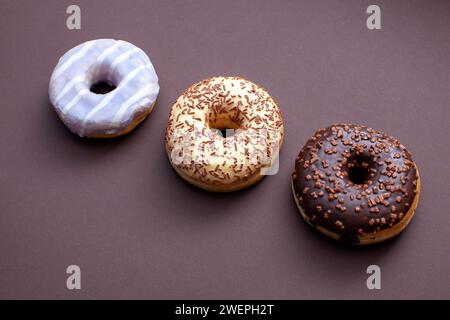 three ring doughnuts isolated on brown background Stock Photo