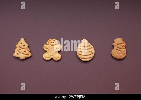 christmas shaped cookies isolated on brown background Stock Photo