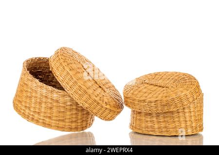 Two straw baskets, macro, isolated on white background. Stock Photo
