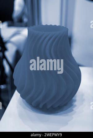 Art object vase printed on a 3D printer. Models created by a 3D printer from blue molten plastic. Concept 3d printing. Additive progressive technologies. New modern technology for creating objects Stock Photo