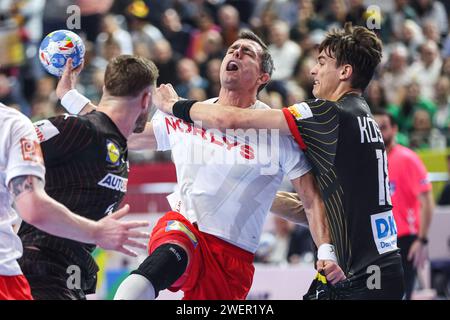 Zagreb, Croatia. 26th Jan, 2024. Rasmus Lauge Schmidt of Denmark is challenged by Julian Koster of Germany during the Men's EHF Euro 2024 second semi-final match between Germany and Denmark at Lanxess Arena on January 26, 2024 in Cologne, Germany. Photo: Sanjin Strukic/PIXSELL Credit: Pixsell/Alamy Live News Stock Photo