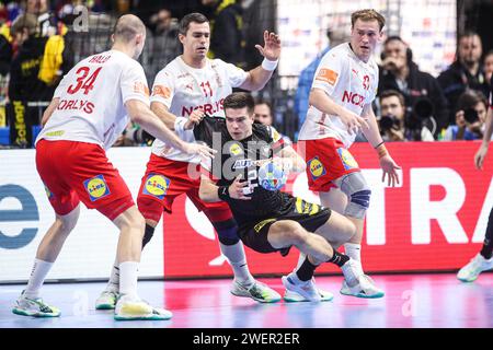 Zagreb, Croatia. 26th Jan, 2024. Renars Uscins of Germany is challenged by Simon Hald Jensen, Rasmus Lauge Schmidt and Simon Bogetoft Pytlick of Denmark during the Men's EHF Euro 2024 second semi-final match between Germany and Denmark at Lanxess Arena on January 26, 2024 in Cologne, Germany. Photo: Sanjin Strukic/PIXSELL Credit: Pixsell/Alamy Live News Stock Photo