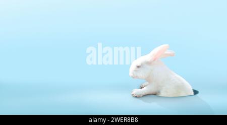 Cute Easter bunny on blue background. Rabbit looking out of a hole. Spring season greeting. Easter egg hunt invitation. Stock Photo