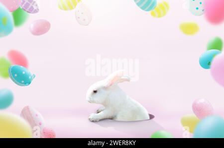 Cute Easter bunny on pink background with Easter eggs. Rabbit looking out of a hole. Spring season greeting. Easter egg hunt invitation. Stock Photo