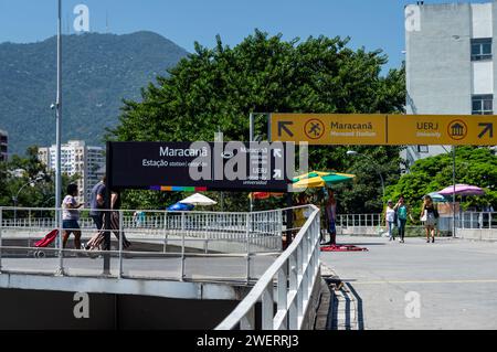 Information signs on the pedestrian bridge that links Maracana train station to Maracana stadium and UERJ buildings under summer clear blue sky. Stock Photo