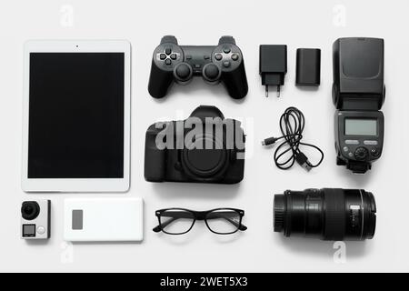 Composition with different modern gadgets on light background Stock Photo
