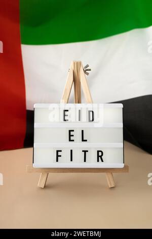 RAMADAN text frame on United Arab Emirates waving flag made from silk ...