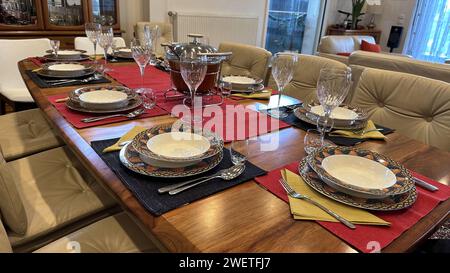Table in living room prepared for dinner Stock Photo