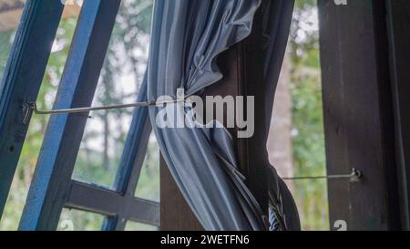 Photo of blue window curtains, very suitable for those of you who are in need of photos about your home Stock Photo