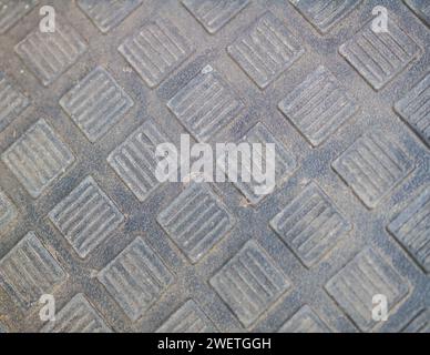 Rough Metallic Diamond Plate Texture on Grunge Industrial Wall Stock Photo
