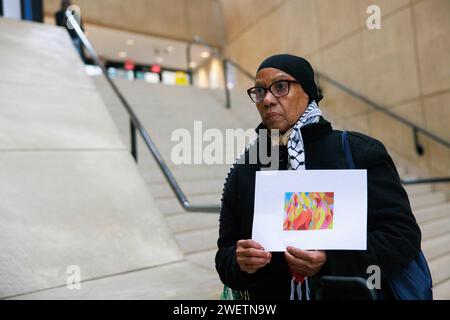 Bloomington, United States. 26th Jan, 2024. A protester holds a placard expressing her opinion during the demonstration. Protesters fill the atrium at the Sidney and Lois Eskenazi Museum of Art: Indiana University to protest against the cancellation of an upcoming exhibit for Palestinian artist Samia Halaby in Bloomington. Halaby, 87, has been outspoken in her support of Palestinians. Credit: SOPA Images Limited/Alamy Live News Stock Photo