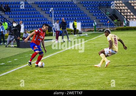 Pasto, Colombia. 26th Jan, 2024. Deportivo Pasto's Israel Alba (L) and Deportes Tolima Kevin Perez (R) during the Deportivo Pasto (1) vs Deportes Tolima (4) match at 'La Libertad Stadium' in Pasto, Colombia, January 26, 2024. Photo by: Sebastian Maya/Long Visual Press Credit: Long Visual Press/Alamy Live News Stock Photo