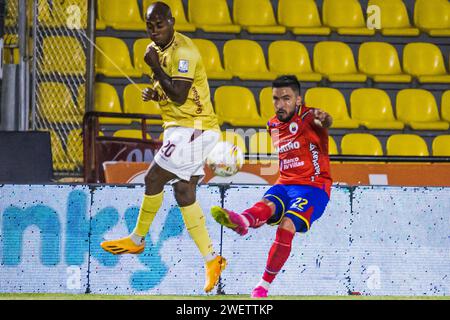 Pasto, Colombia. 26th Jan, 2024. Deportes Tolima Junior Hernandez (L) tries blocking a shot from Deportivo Pasto's Israel Alba (R) during the Deportivo Pasto (1) vs Deportes Tolima (4) match at 'La Libertad Stadium' in Pasto, Colombia, January 26, 2024. Photo by: Sebastian Maya/Long Visual Press Credit: Long Visual Press/Alamy Live News Stock Photo