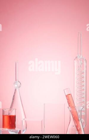 Lab theme with lab glassware filled pink liquid on pink background. Concept: research, biochemistry, nature, pharmaceutical medicine Stock Photo