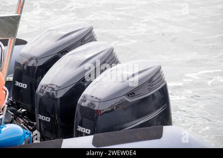 Lifeboat with three black motors on it Stock Photo