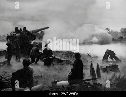 A gun crew of the Royal Artillery in action in Normandy a few days after D-Day, 6th June 1944 during the Second World War. Stock Photo