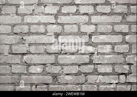 Close-up of flat brick wall with rows of cement concrete bricks as background Stock Photo