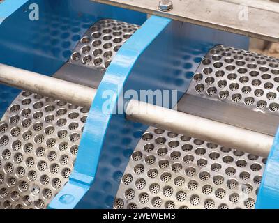 Detail photo of twin screw press for processing of fish and animal byproducts. Stock Photo