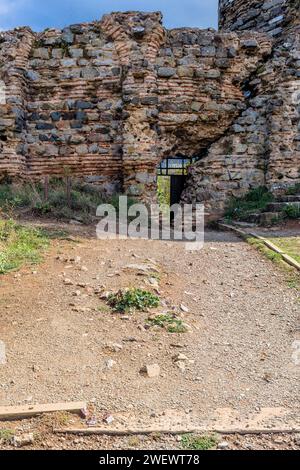 Interior stone and brick wall of castle ruins with opening for egress in Istanbul, Tuerkiye Stock Photo