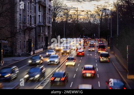 Cars with light trails in the evening, city centre traffic on busy B14 federal road at Neckartor, Stuttgart, Baden-Wuerttemberg, Germany Stock Photo