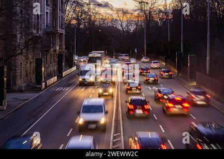 Cars with light trails in the evening, city centre traffic on busy B14 federal road at Neckartor, Stuttgart, Baden-Wuerttemberg, Germany Stock Photo