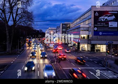 Cars with light trails in the evening, city centre traffic on busy B14 federal road at Neckartor, Stuttgart, Baden-Wuerttemberg, Germany Stock Photo
