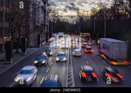 Cars with light trails in the evening, city centre traffic on busy B14 federal road at Neckartor, Stuttgart, Baden-Wuerttemberg, Germany Stock Photo