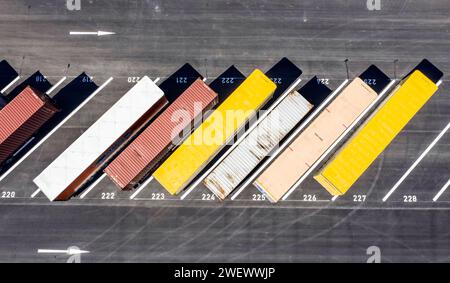 Truck trailers and truck containers standing in a car park in Gruenheide, 23.04.2022 Stock Photo
