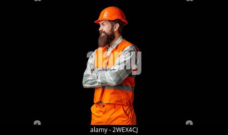 Man builder, civil engineer working. Builder in hard hat, foreman or repairman in helmet. Man builders, industry. Bearded man worker with beard in Stock Photo