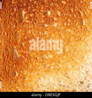 Close-up top view of sliced bread showcasing its texture and detail. The image is a high-quality, detailed shot, illustrating the texture of the fresh Stock Photo
