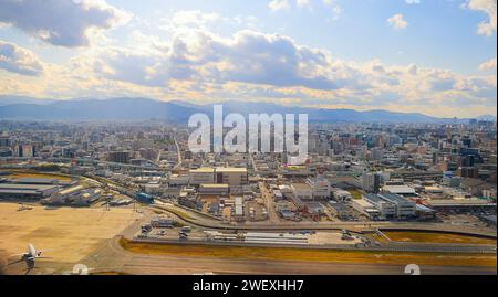 View of Fukuoka's CBD from above, taken in the hazy early hours of the morning, close to Fukuoka International Airport. Stock Photo