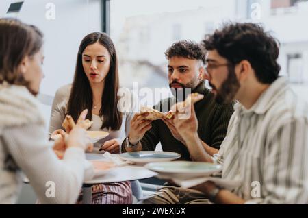 Business professionals enjoying a lunch break, sharing a pizza. Taking a moment to relax and refuel, fostering teamwork and success. Stock Photo
