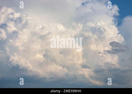A dramatic cloudscape and blue sky on a summer evening Stock Photo